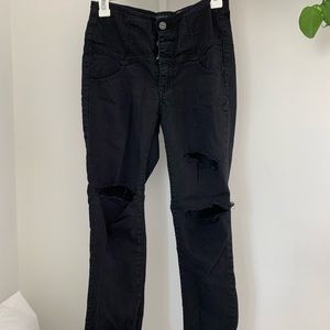 Black skinny jeans. High waisted. Distressed.